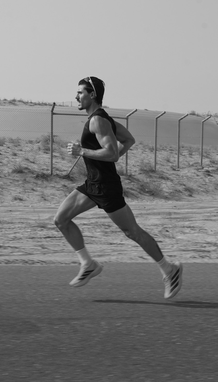Robbie running on a desert road